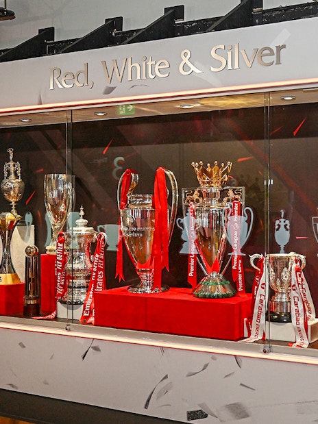 Visitors exploring the iconic Liverpool FC Stadium during a guided tour, with Museum Entrance Tickets included