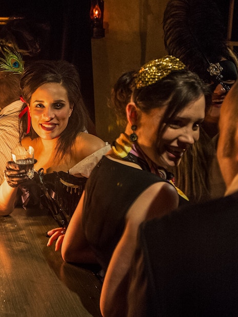 Visitor enjoying drinks at London Dungeon bar.