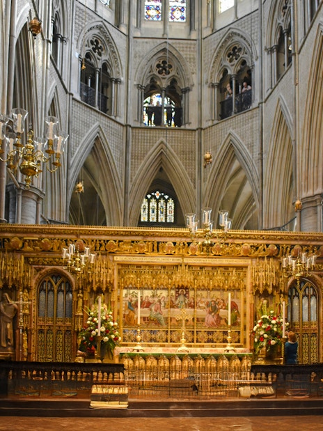 Westminster Abbey interior with ornate arches and historical artifacts.