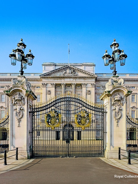 Buckingham Palace guards in red uniforms marching during Changing of the Guard, London.