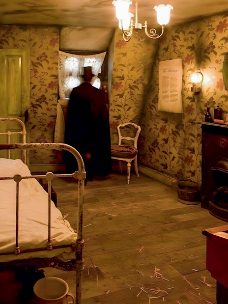 Jack the Ripper Museum room with historical artifacts and crime scene photos in London.