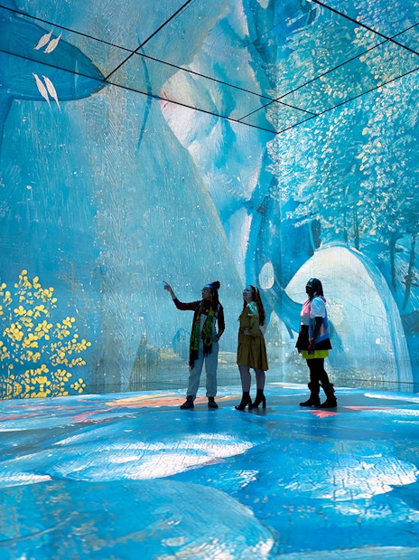 Tourist looking at exhibit at the gallery - Beyond Reality