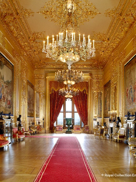 Windsor Castle interior showcasing ornate ceiling and historic furnishings.