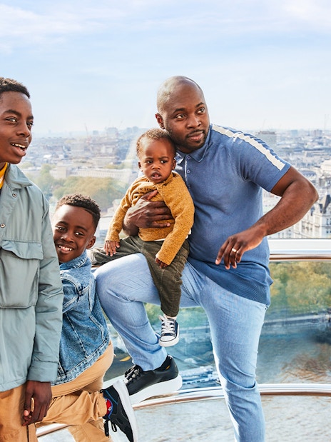 London Eye and Thames River Cruise boat on the River Thames, London.