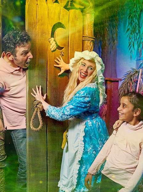 Visitors enjoying interactive Shrek's Adventure! London Tickets tour, featuring beloved Shrek characters and immersive storytelling