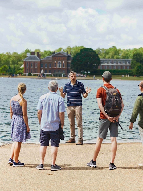 Kensington Palace garden view with visitors with guide