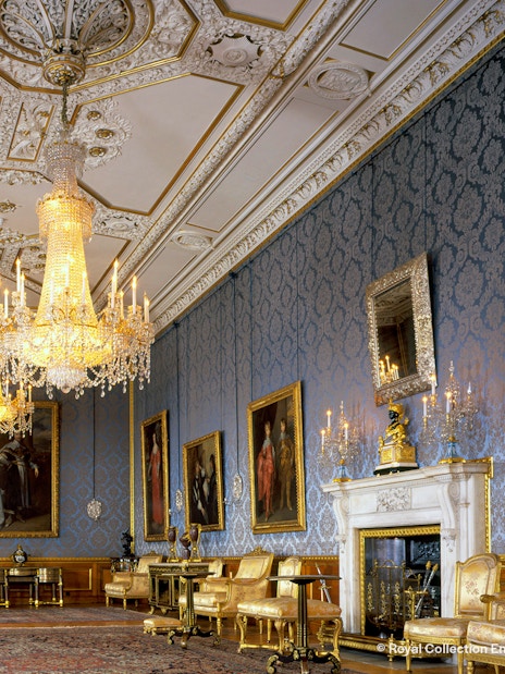 Windsor Castle interior with ornate ceiling and historical artifacts.
