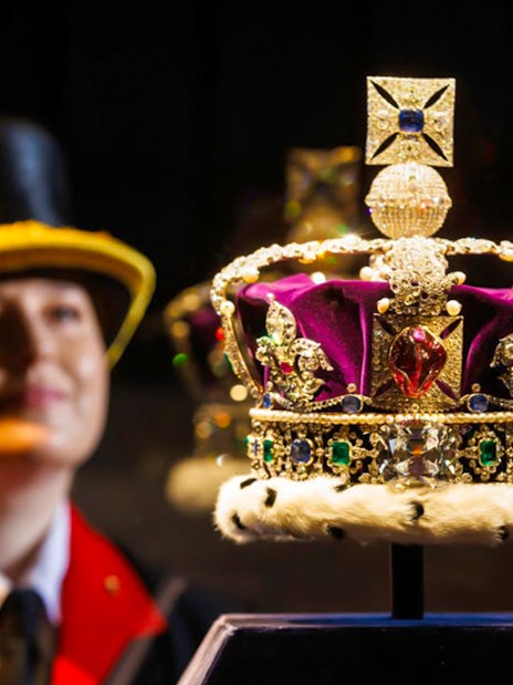 Tourists exploring the Eiffel Tower with views of Paris, part of a combo tour with the Louvre Museum.
