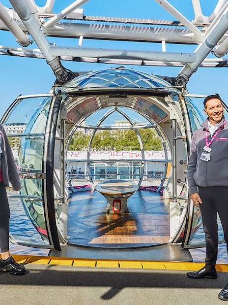 London Eye capsules overlooking the Thames River in London.