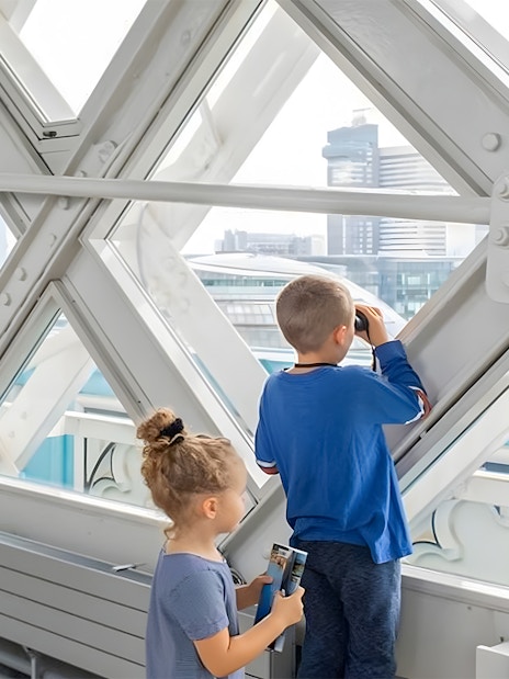 Guests walking on Tower Bridge in London with city skyline in the background