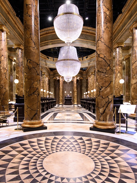 Visitors exploring Gringotts Wizarding Bank at Harry Potter Warner Bros. Studio Tour, London.