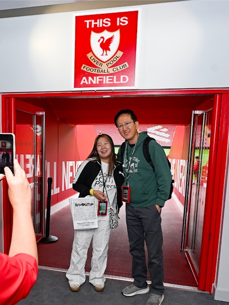 Liverpool FC Stadium Tour and Museum Entrance Tickets, featuring a panoramic view of the iconic stadium filled with cheering fans