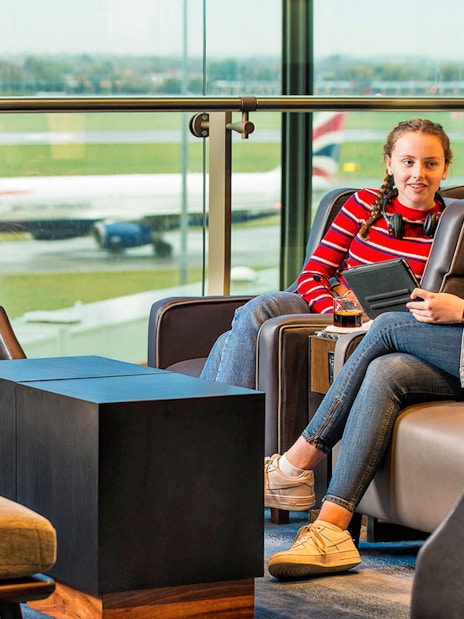 Girls relaxing in Plaza Premium Lounge, Heatherow Airport London