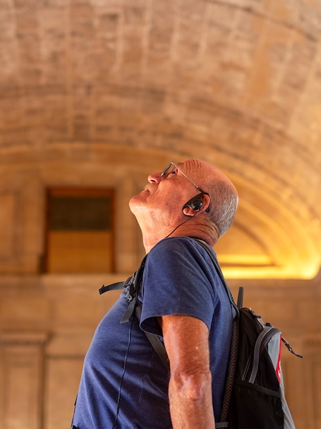 tourist listening to audio guide in Roman Pantheon
