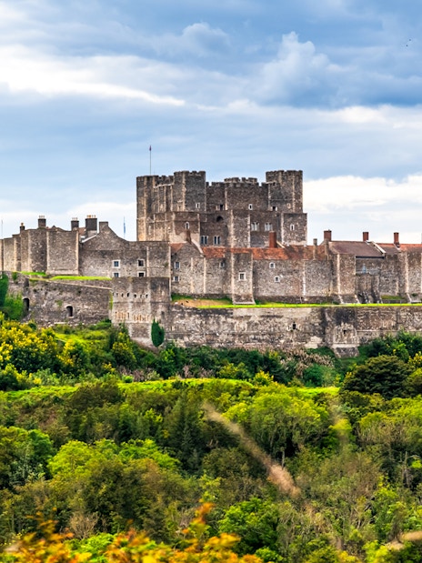 Dover Castle with lush green landscape, viewed from a guided tour departing London.