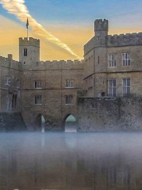 Leeds Castle with moat, Canterbury Cathedral, and White Cliffs of Dover in tour itinerary.