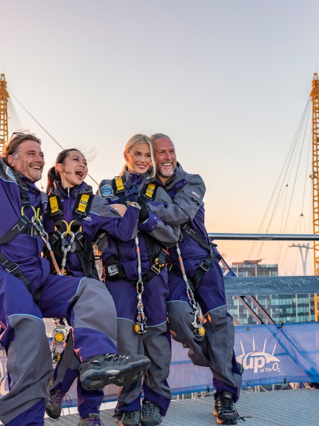 Climbers on O2 Arena roof with London skyline view, part of London Explorer Pass by Go City.