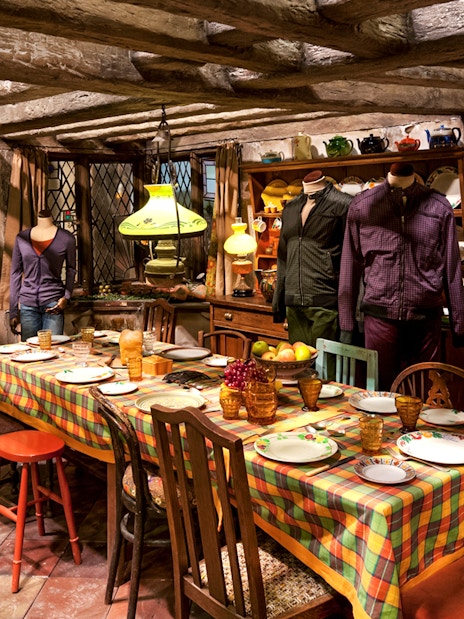 Weasley kitchen exhibit at Harry Potter London tour featuring magical household items.