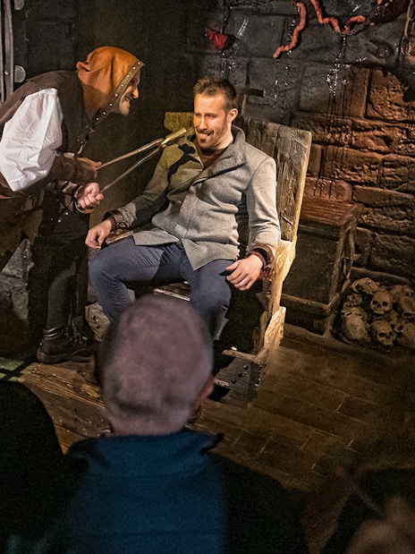Visitor in London Dungeon's Scream Spirit Torture Chamber experience.