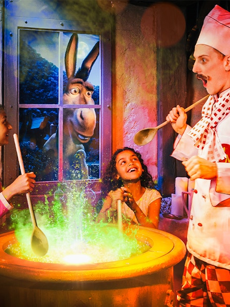 Visitors enjoying interactive Shrek's Adventure! London Tickets tour, featuring beloved Shrek characters and immersive storytelling