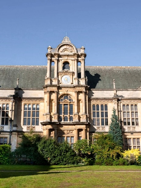 Examination Schools at University of Oxford with historic architecture and college tower in view.