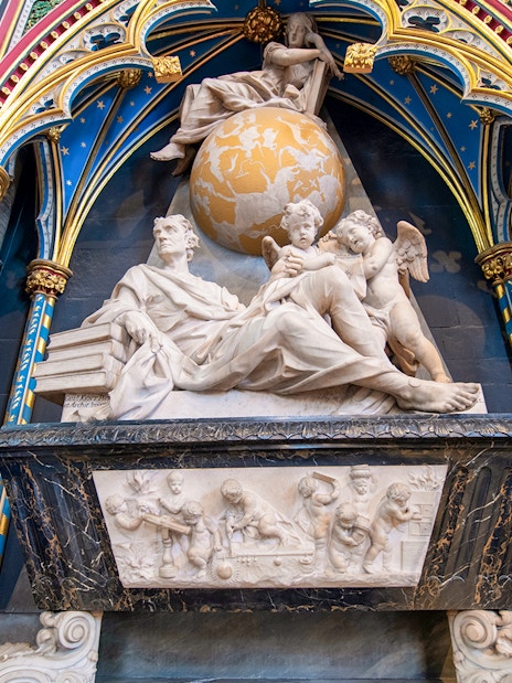 Sir Isaac Newton monument inside Westminster Abbey during guided tour.